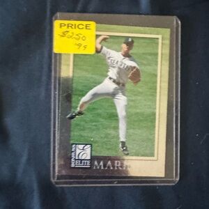 Donruss Elite Baseball Card - Player in White Uniform with Green Field